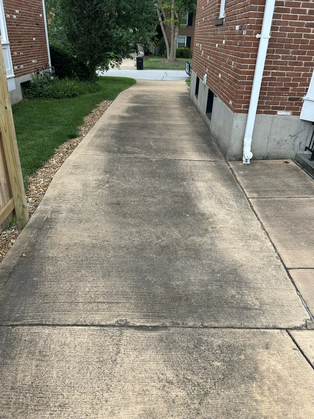 Stained concrete driveway in St. Louis before pressure washing