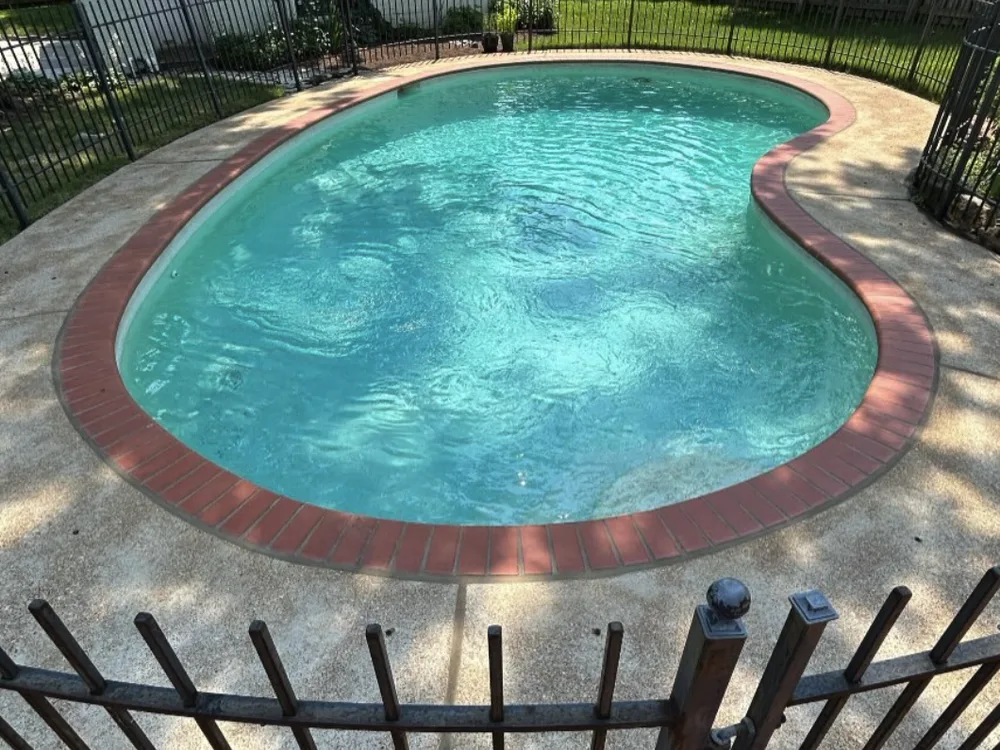 The same pool deck with clean concrete after pressure washing by Prime Power Wash